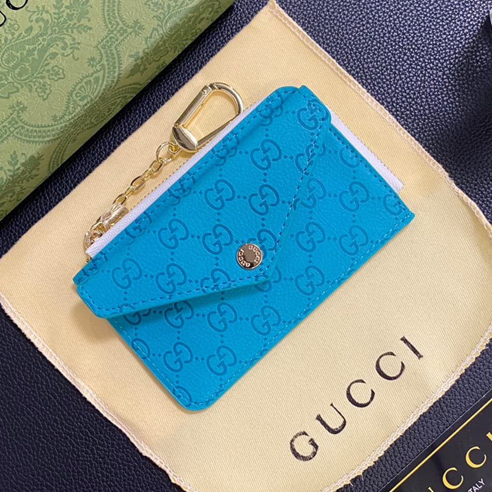 Gucci Embossed GG Supreme Card Holder with Gold-Tone Logo - Luxury Designer Wallet