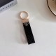 Prada Pebble Grain Leather Luxury Keychain - Signature Triangle Logo with Gold-Tone Hardware