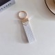 Prada Pebble Grain Leather Luxury Keychain - Signature Triangle Logo with Gold-Tone Hardware