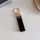 Prada Woven Leather Luxury Keychain - Signature Triangle Logo with Gold-Tone Hardware