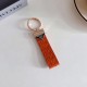 Prada Woven Leather Luxury Keychain - Signature Triangle Logo with Gold-Tone Hardware