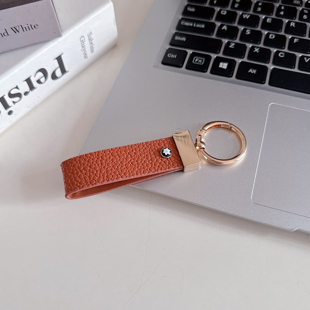 Montblanc Pebbled Leather Luxury Keychain - Hexagon Logo with Gold-Tone Hardware