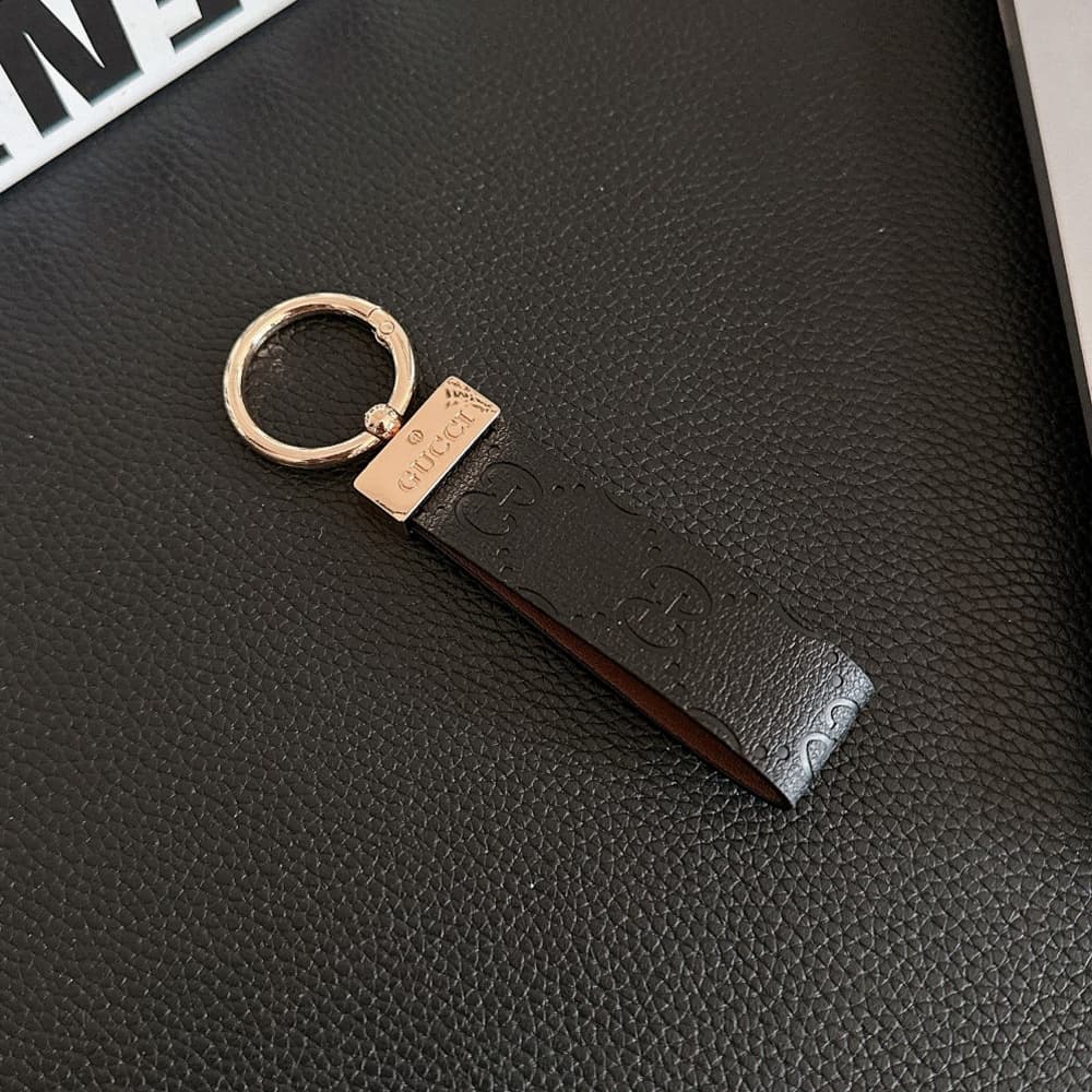 Gucci Embossed GG Monogram Leather Luxury Keychain - Gold-Tone Metal Accents
