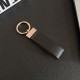 Gucci Embossed GG Monogram Leather Luxury Keychain - Gold-Tone Metal Accents