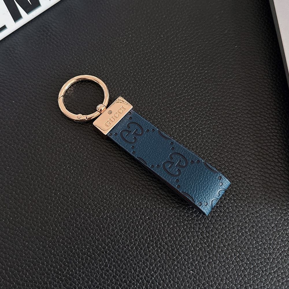 Gucci Embossed GG Monogram Leather Luxury Keychain - Gold-Tone Metal Accents