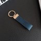Gucci Embossed GG Monogram Leather Luxury Keychain - Gold-Tone Metal Accents