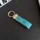 Gucci Embossed GG Monogram Leather Luxury Keychain - Gold-Tone Metal Accents