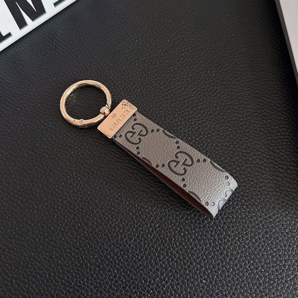 Gucci Embossed GG Monogram Leather Luxury Keychain - Gold-Tone Metal Accents