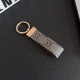 Gucci Embossed GG Monogram Leather Luxury Keychain - Gold-Tone Metal Accents