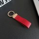Gucci Embossed GG Monogram Leather Luxury Keychain - Gold-Tone Metal Accents