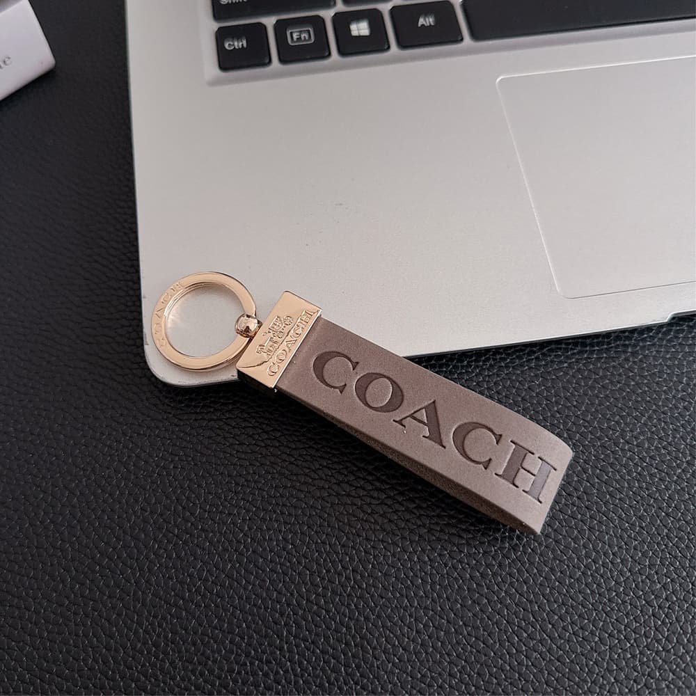 Coach Embossed Signature Leather Luxury Keychain - Carriage Logo Gold-Tone Hardware
