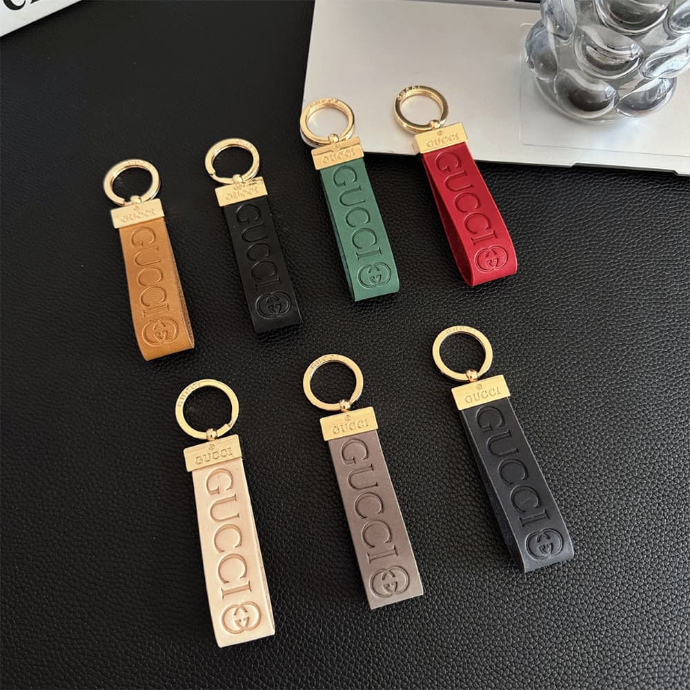 Gucci Embossed GG Monogram Leather Luxury Keychain - Gold-Tone Hardware