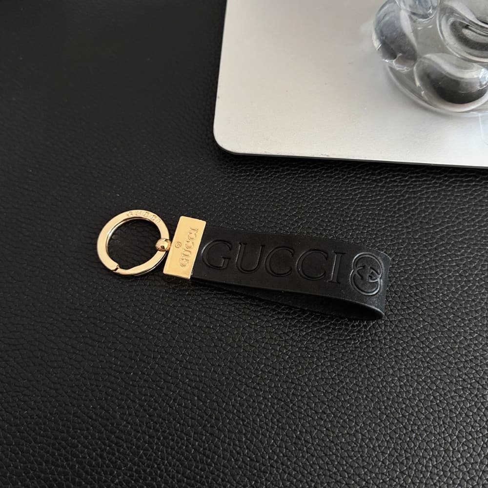 Gucci Embossed GG Monogram Leather Luxury Keychain - Gold-Tone Hardware
