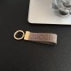 Gucci Embossed GG Monogram Leather Luxury Keychain - Gold-Tone Hardware