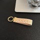 Gucci Embossed GG Monogram Leather Luxury Keychain - Gold-Tone Hardware