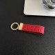 Gucci Embossed GG Monogram Leather Luxury Keychain - Gold-Tone Hardware