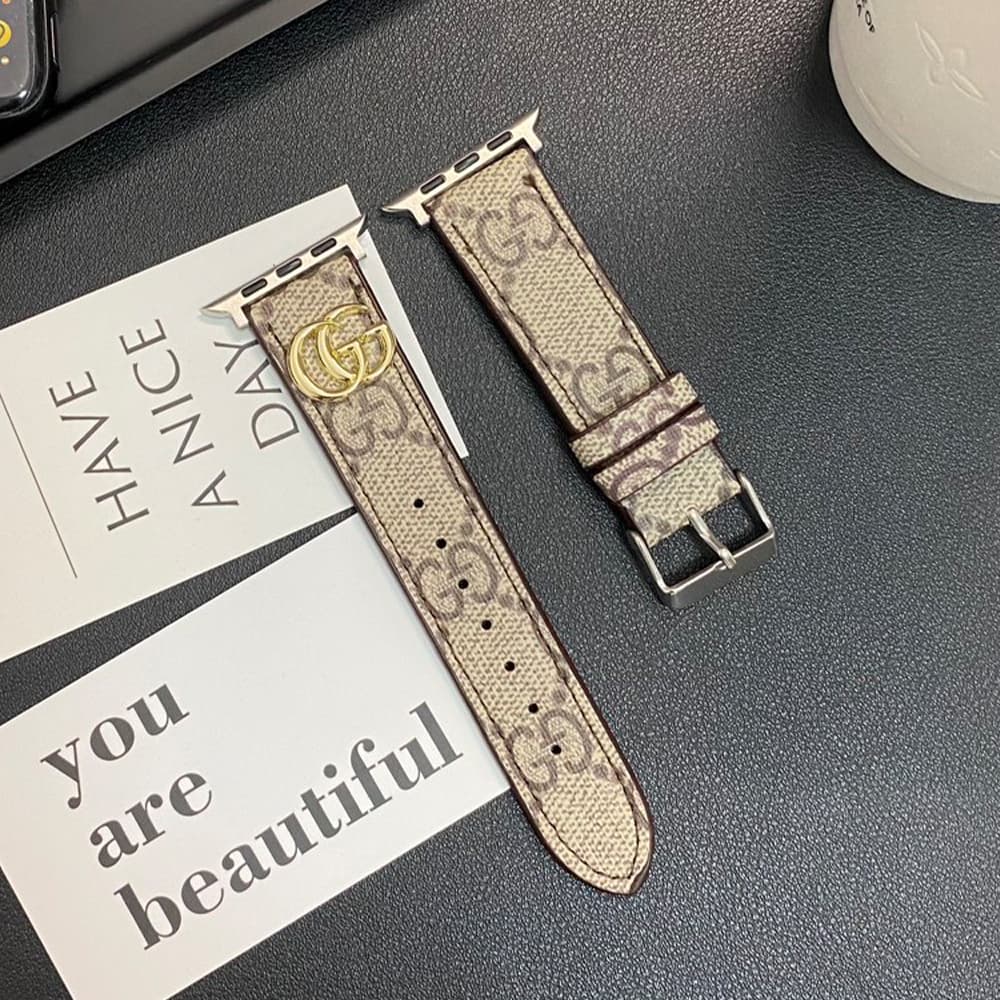 Gucci GG Luxury Apple Watch Band - Monogram with Gold-Tone Hardware Gucci GG Luxury Apple Watch Band - Monogram with Gold-Tone Hardware