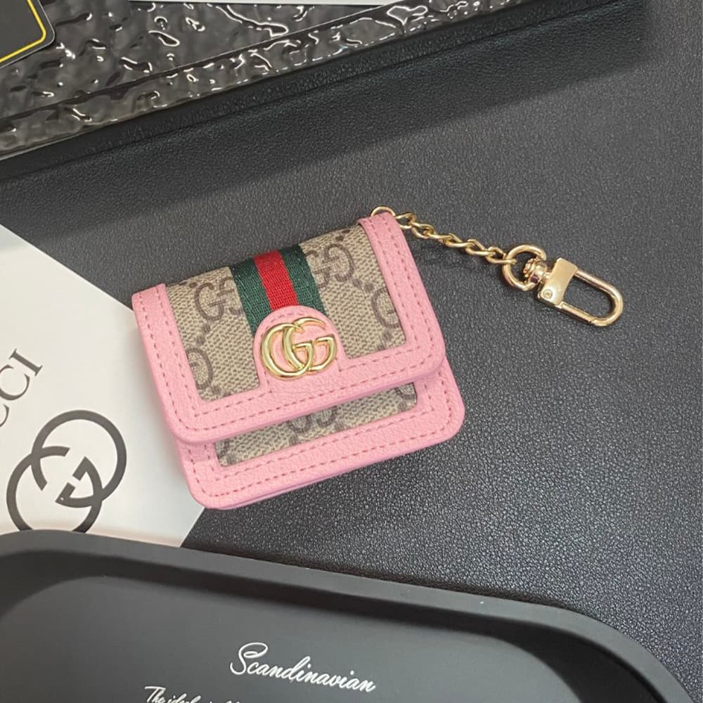 Gucci GG Luxury AirPods & Samsung Buds Case - Monogram with Web Strap & Metal Logo Gucci GG Luxury AirPods & Samsung Buds Case - Monogram with Web Strap & Metal Logo