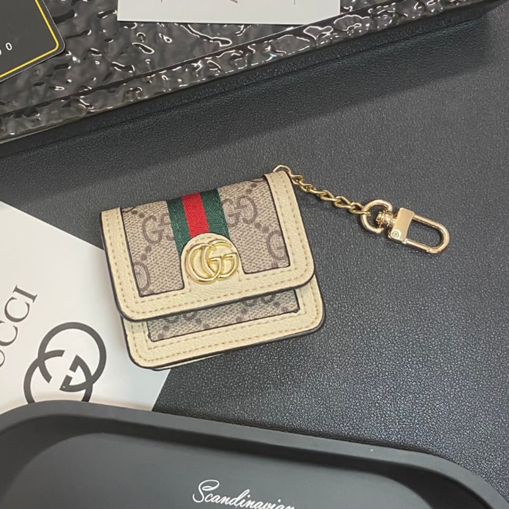 Gucci GG Luxury AirPods & Samsung Buds Case - Monogram with Web Strap & Metal Logo Gucci GG Luxury AirPods & Samsung Buds Case - Monogram with Web Strap & Metal Logo