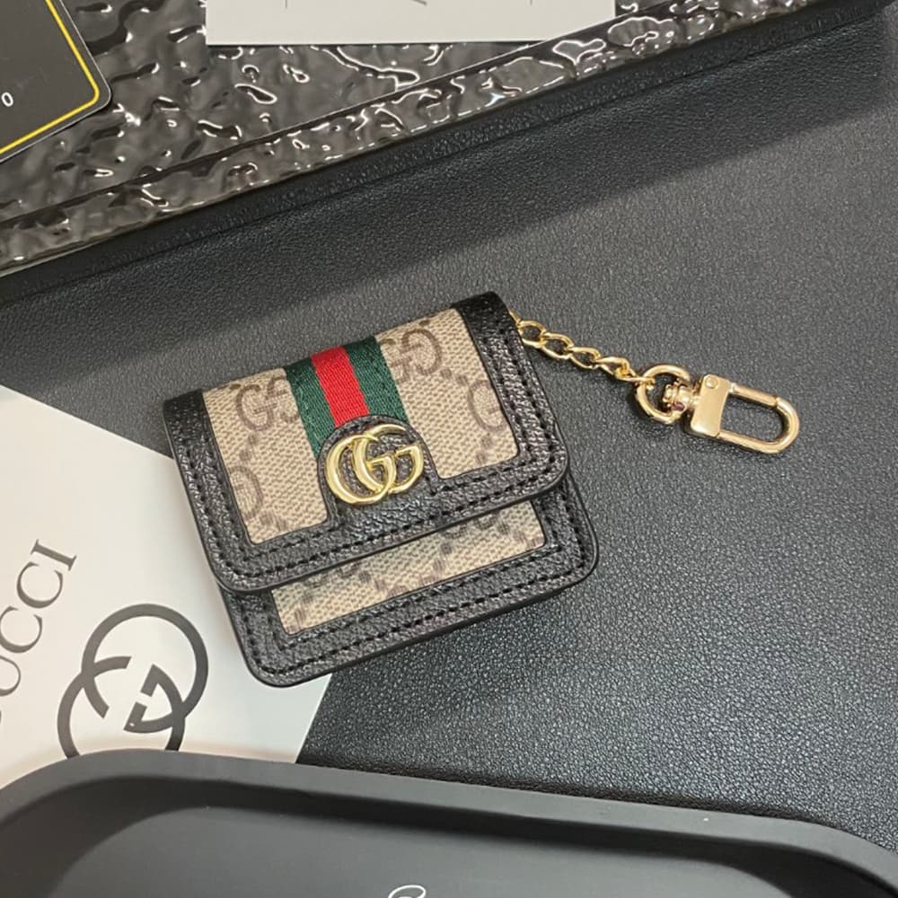 Gucci GG Luxury AirPods & Samsung Buds Case - Monogram with Web Strap & Metal Logo Gucci GG Luxury AirPods & Samsung Buds Case - Monogram with Web Strap & Metal Logo