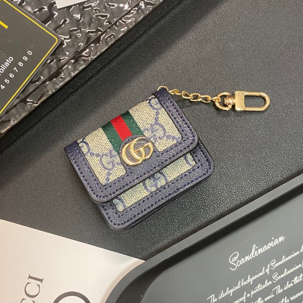 Gucci GG Luxury AirPods & Samsung Buds Case - Monogram with Web Strap & Metal Logo Gucci GG Luxury AirPods & Samsung Buds Case - Monogram with Web Strap & Metal Logo