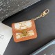 CELINE Triomphe Luxury AirPods & Samsung Buds Case - Embroidered Monogram with Gold Charm CELINE Triomphe Luxury AirPods & Samsung Buds Case - Embroidered Monogram with Gold Charm