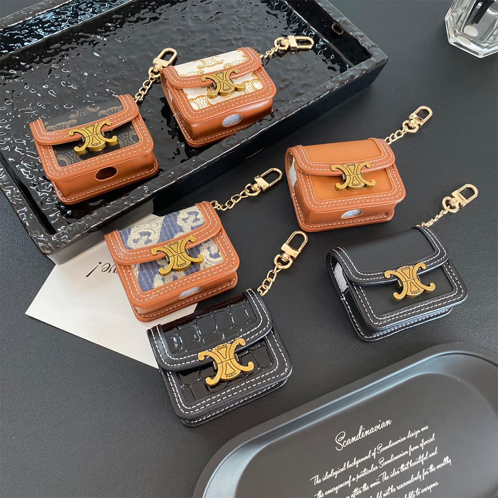 CELINE Triomphe Luxury AirPods & Samsung Buds Case - Embroidered Monogram with Gold Charm CELINE Triomphe Luxury AirPods & Samsung Buds Case - Embroidered Monogram with Gold Charm