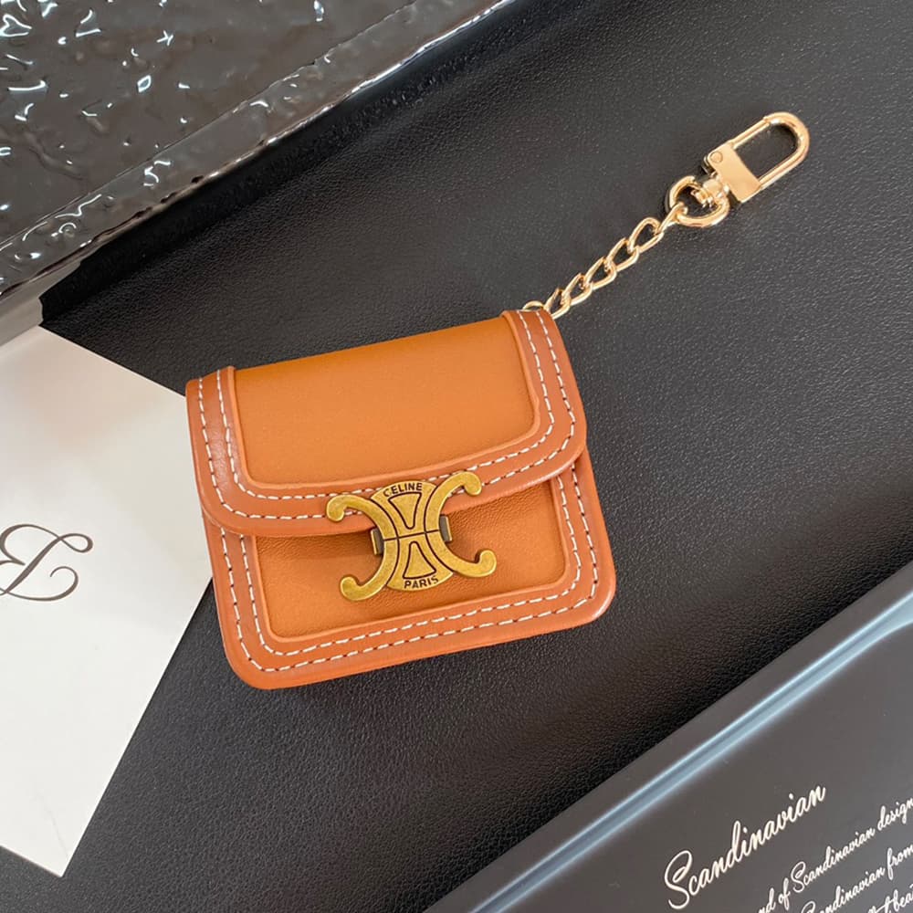 CELINE Triomphe Luxury AirPods & Samsung Buds Case - Embroidered Monogram with Gold Charm CELINE Triomphe Luxury AirPods & Samsung Buds Case - Embroidered Monogram with Gold Charm