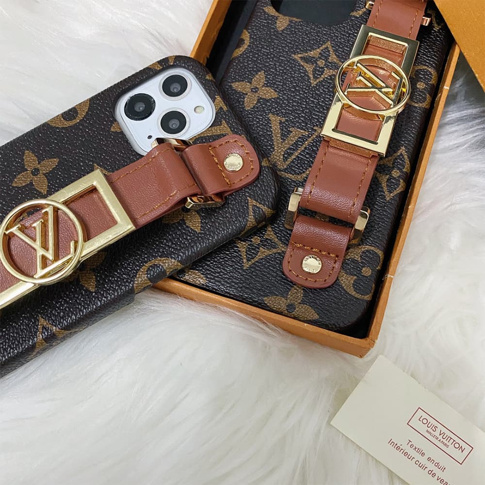 Louis Vuitton Luxury Wristlet iPhone Case - Permanent Monogram Strap (Gold LV Charm) Louis Vuitton Luxury Wristlet iPhone Case - Permanent Monogram Strap (Gold LV Charm)