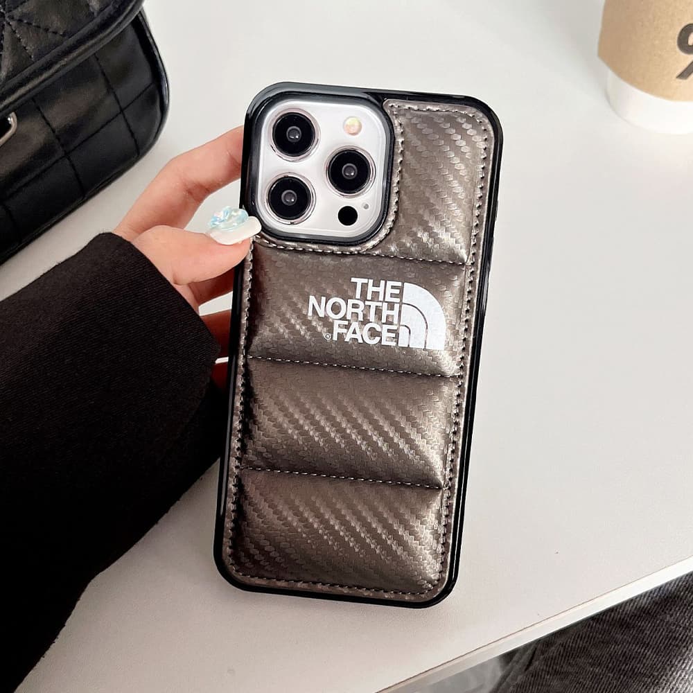 The North Face Luxury iPhone Case - Puffer Jacket Design with Carbon Fiber Texture (Rugged Protective Cover) The North Face Luxury iPhone Case - Puffer Jacket Design with Carbon Fiber Texture (Rugged Protective Cover)