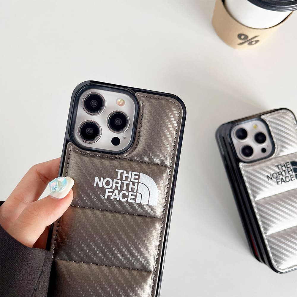 The North Face Luxury iPhone Case - Puffer Jacket Design with Carbon Fiber Texture (Rugged Protective Cover) The North Face Luxury iPhone Case - Puffer Jacket Design with Carbon Fiber Texture (Rugged Protective Cover)