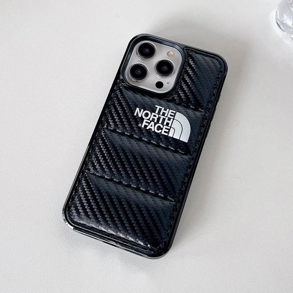The North Face Luxury iPhone Case - Puffer Jacket Design with Carbon Fiber Texture (Rugged Protective Cover) The North Face Luxury iPhone Case - Puffer Jacket Design with Carbon Fiber Texture (Rugged Protective Cover)