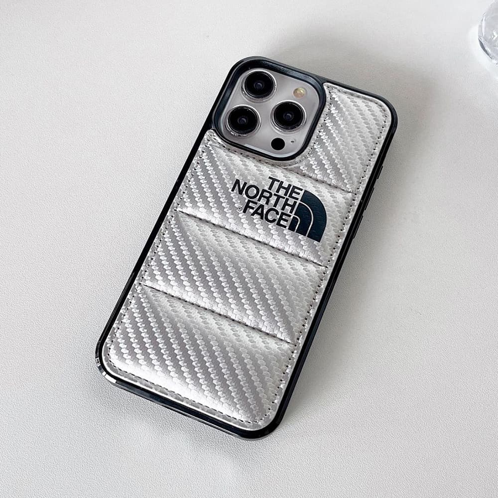 The North Face Luxury iPhone Case - Puffer Jacket Design with Carbon Fiber Texture (Rugged Protective Cover) The North Face Luxury iPhone Case - Puffer Jacket Design with Carbon Fiber Texture (Rugged Protective Cover)