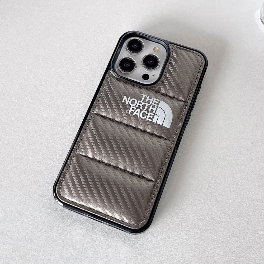 The North Face Luxury iPhone Case - Puffer Jacket Design with Carbon Fiber Texture (Rugged Protective Cover) The North Face Luxury iPhone Case - Puffer Jacket Design with Carbon Fiber Texture (Rugged Protective Cover)