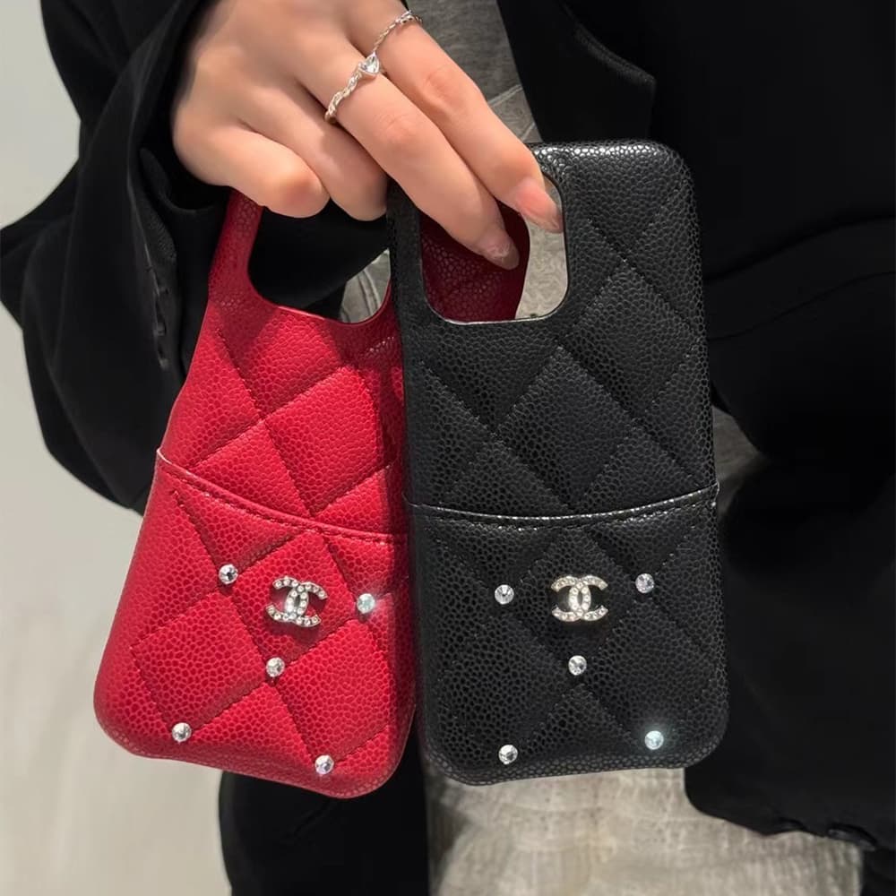 Chanel Luxury iPhone Case - Quilted Diamond Stitch & CC Logo with Crystals (Multiple Colors) Chanel Luxury iPhone Case - Quilted Diamond Stitch & CC Logo with Crystals (Multiple Colors)