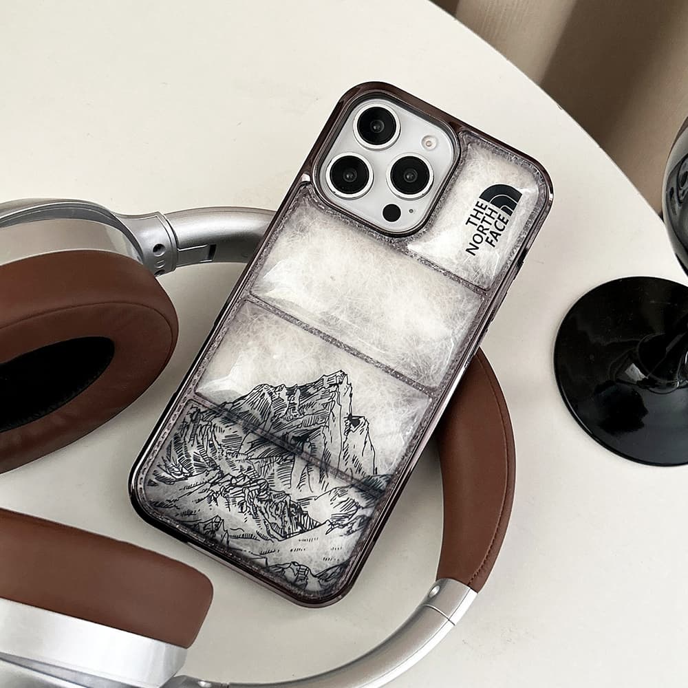 The North Face Luxury iPhone Case - Mountain Print with Puffer Quilted Design The North Face Luxury iPhone Case - Mountain Print with Puffer Quilted Design