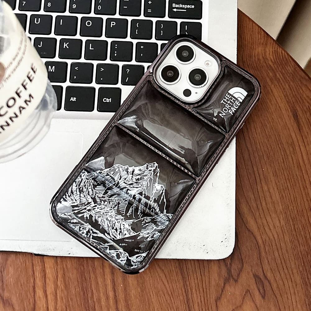 The North Face Luxury iPhone Case - Mountain Print with Puffer Quilted Design The North Face Luxury iPhone Case - Mountain Print with Puffer Quilted Design