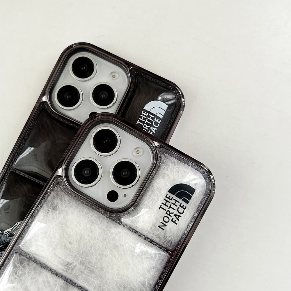 The North Face Luxury iPhone Case - Mountain Print with Puffer Quilted Design The North Face Luxury iPhone Case - Mountain Print with Puffer Quilted Design